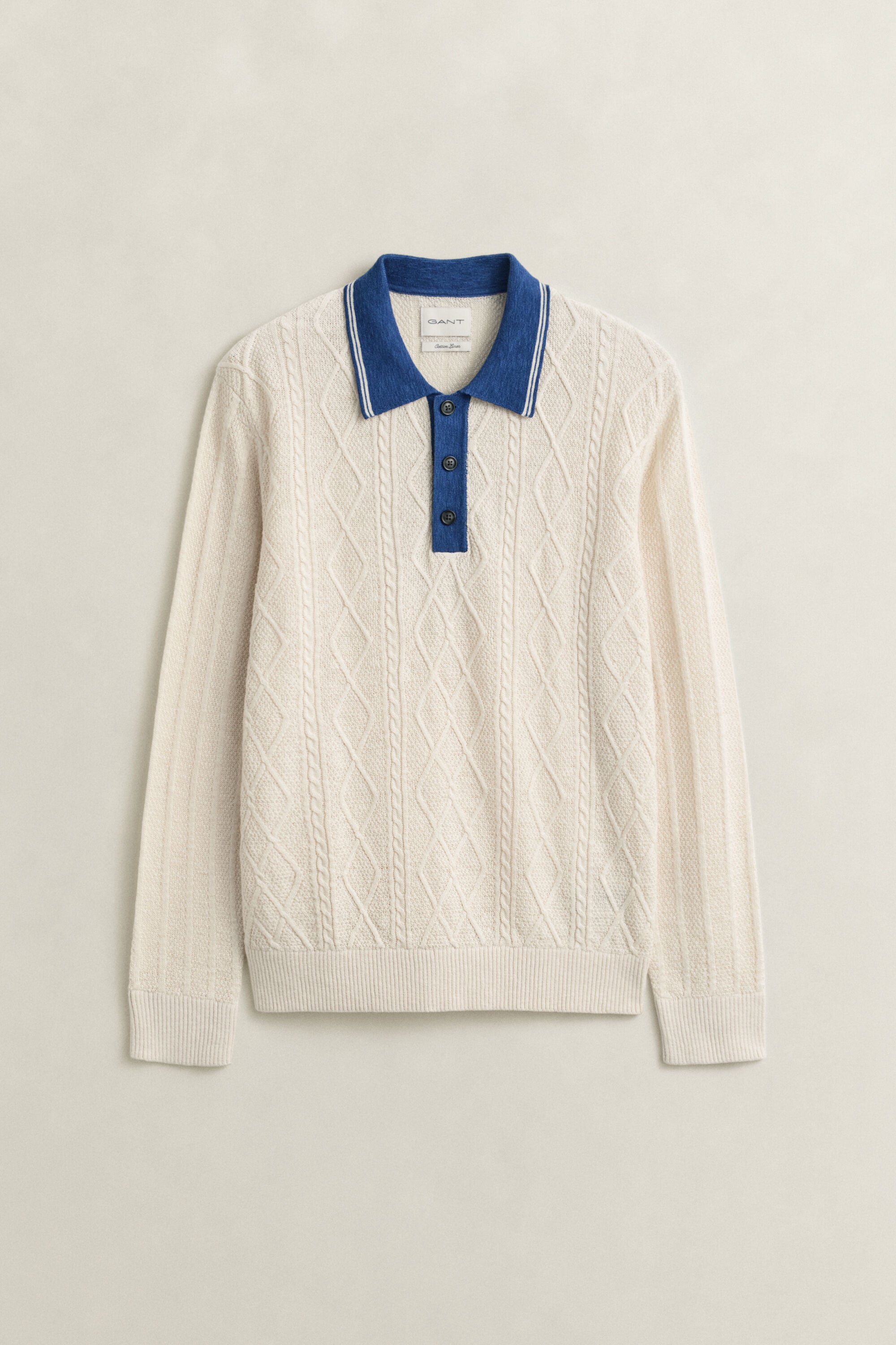 Polosweater med kabelstrik