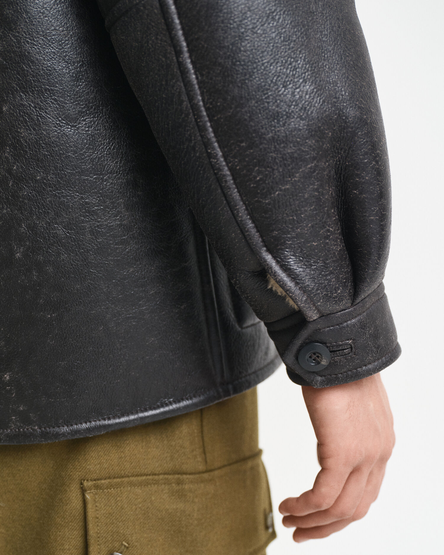 Lammeskindsjakke med slidt læderlook