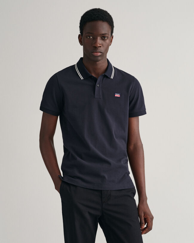 Piqu&eacute; poloskjorte med stribet kontrastfarvet krave