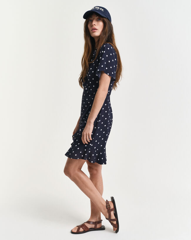 Kjole med flæser og prikket tryk