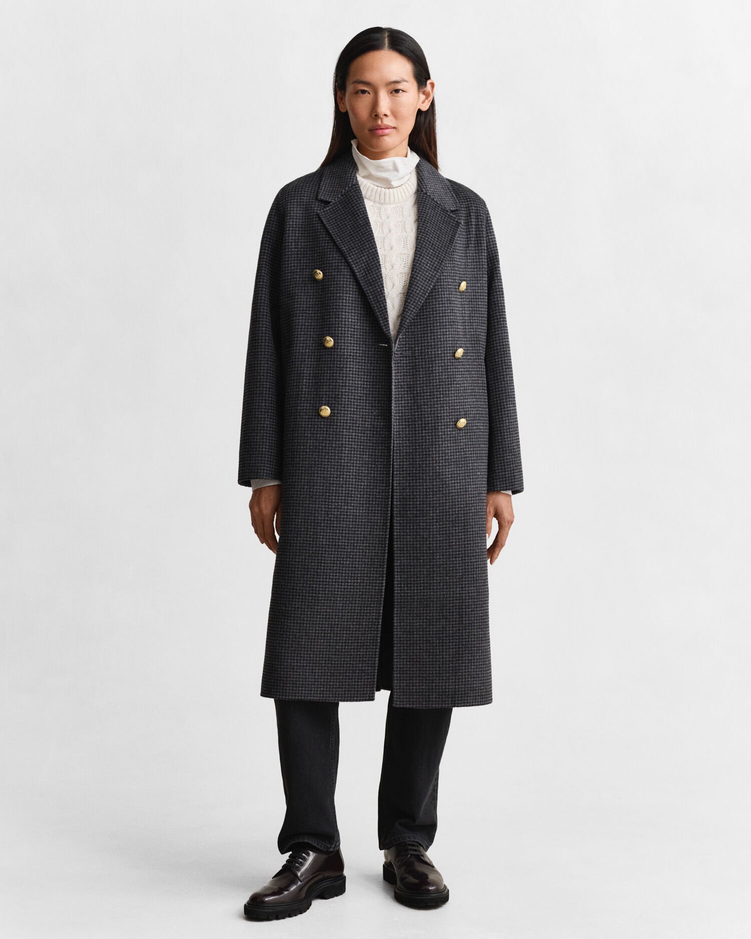 Ternet håndsyet frakke