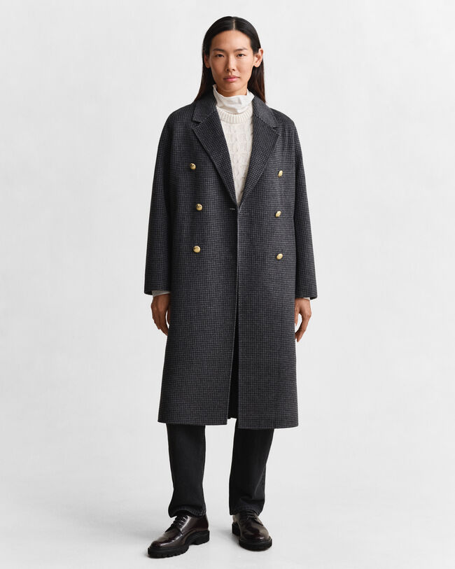 Ternet håndsyet frakke