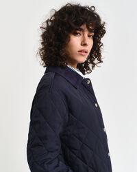 Quiltet frakke med detaljer i jernbanefløjl