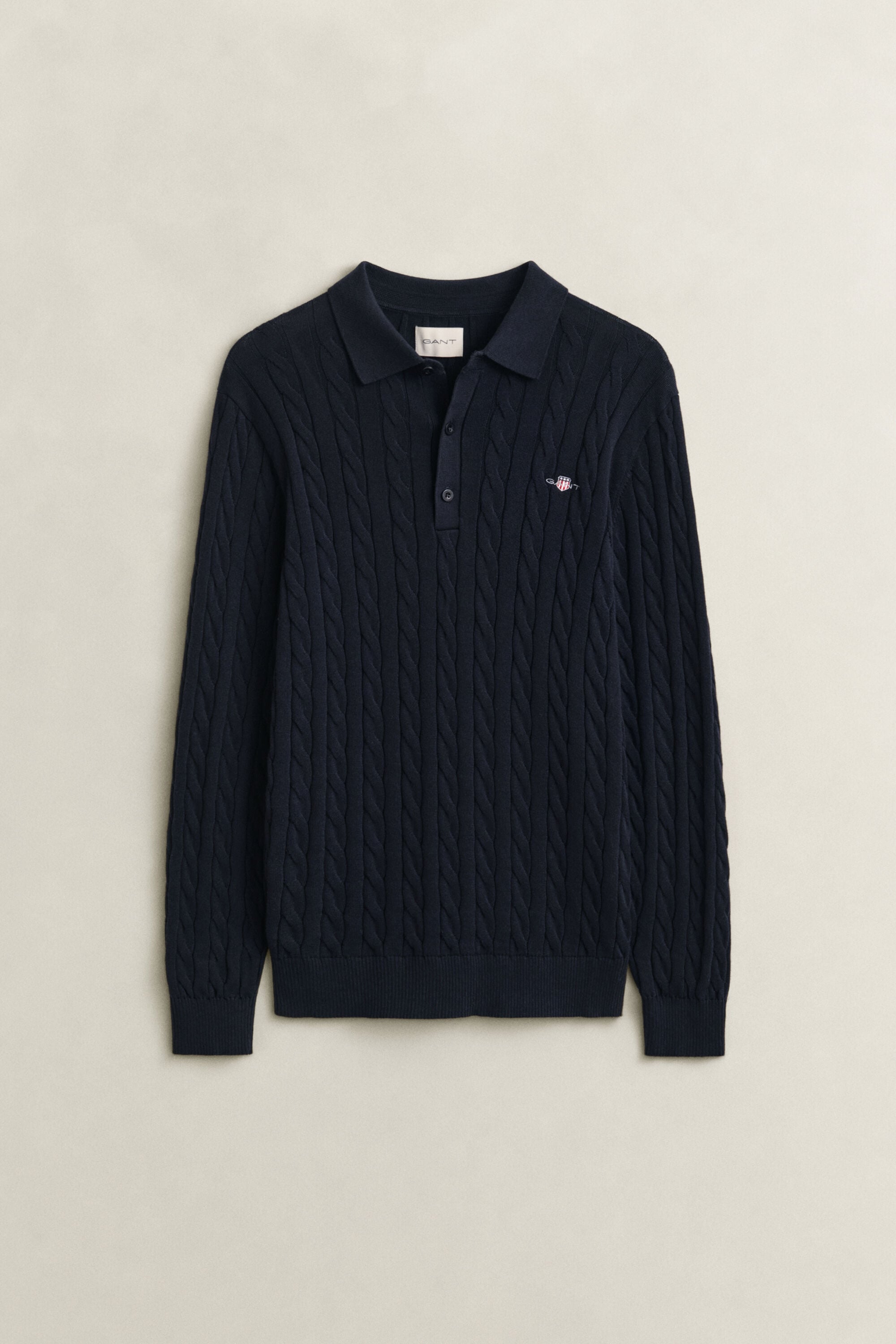 Polosweater i bomuld med kabelstrik