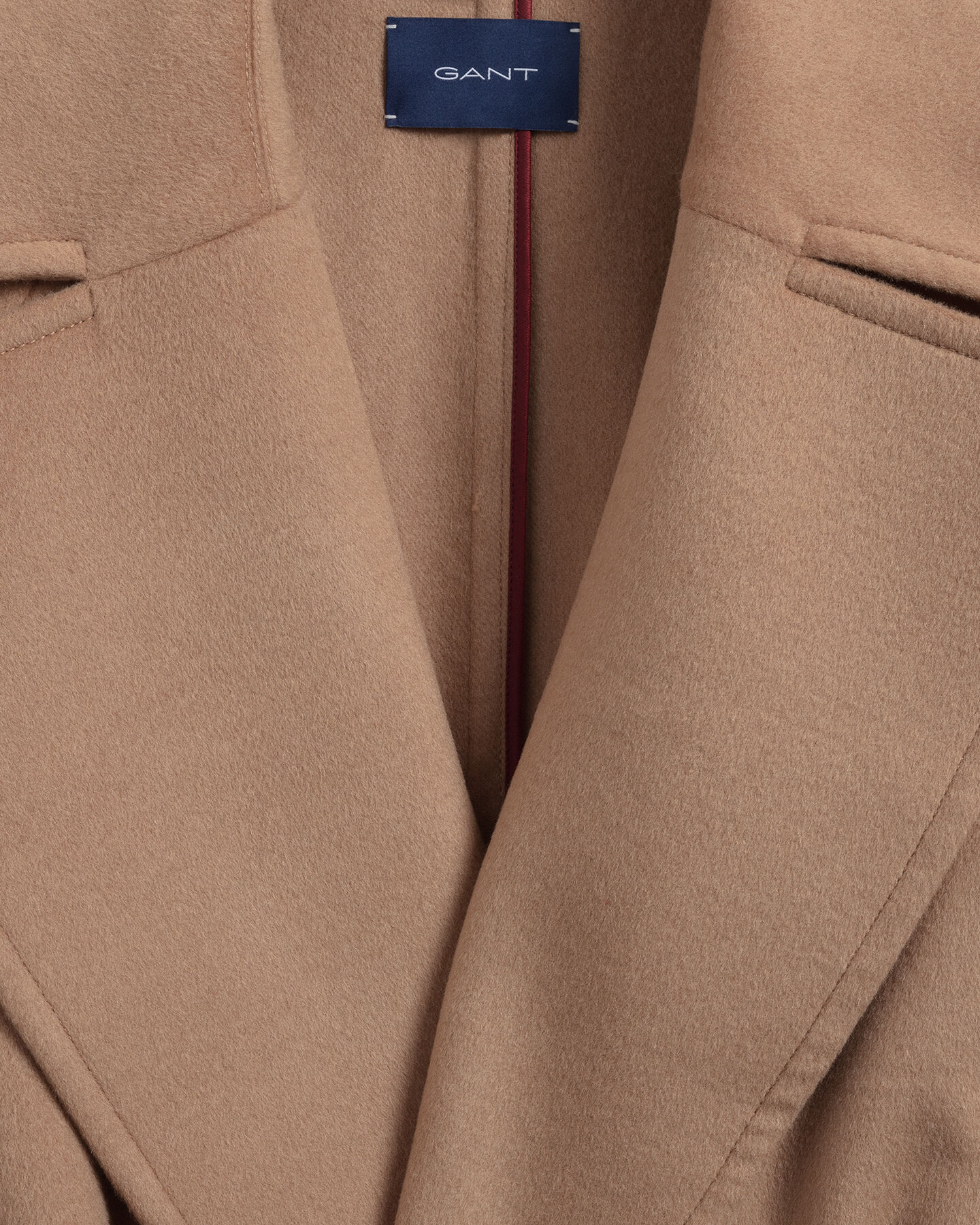 Frakke af uldblanding med bælte