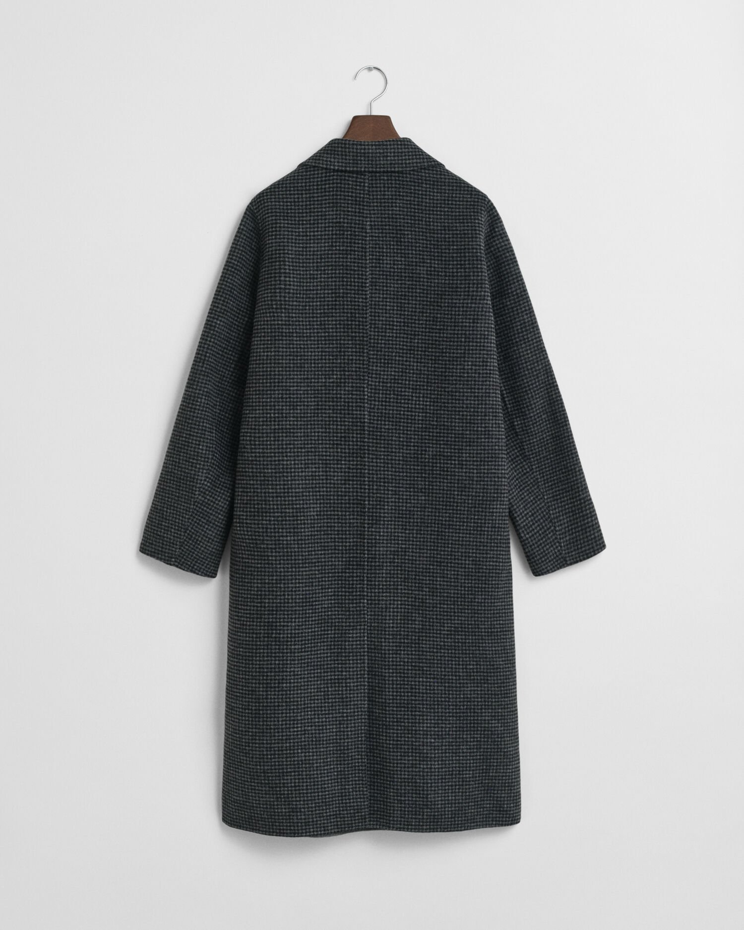 Ternet håndsyet frakke