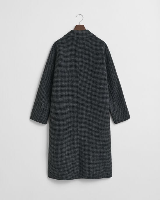 Ternet håndsyet frakke