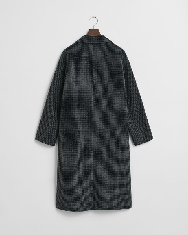 Ternet håndsyet frakke