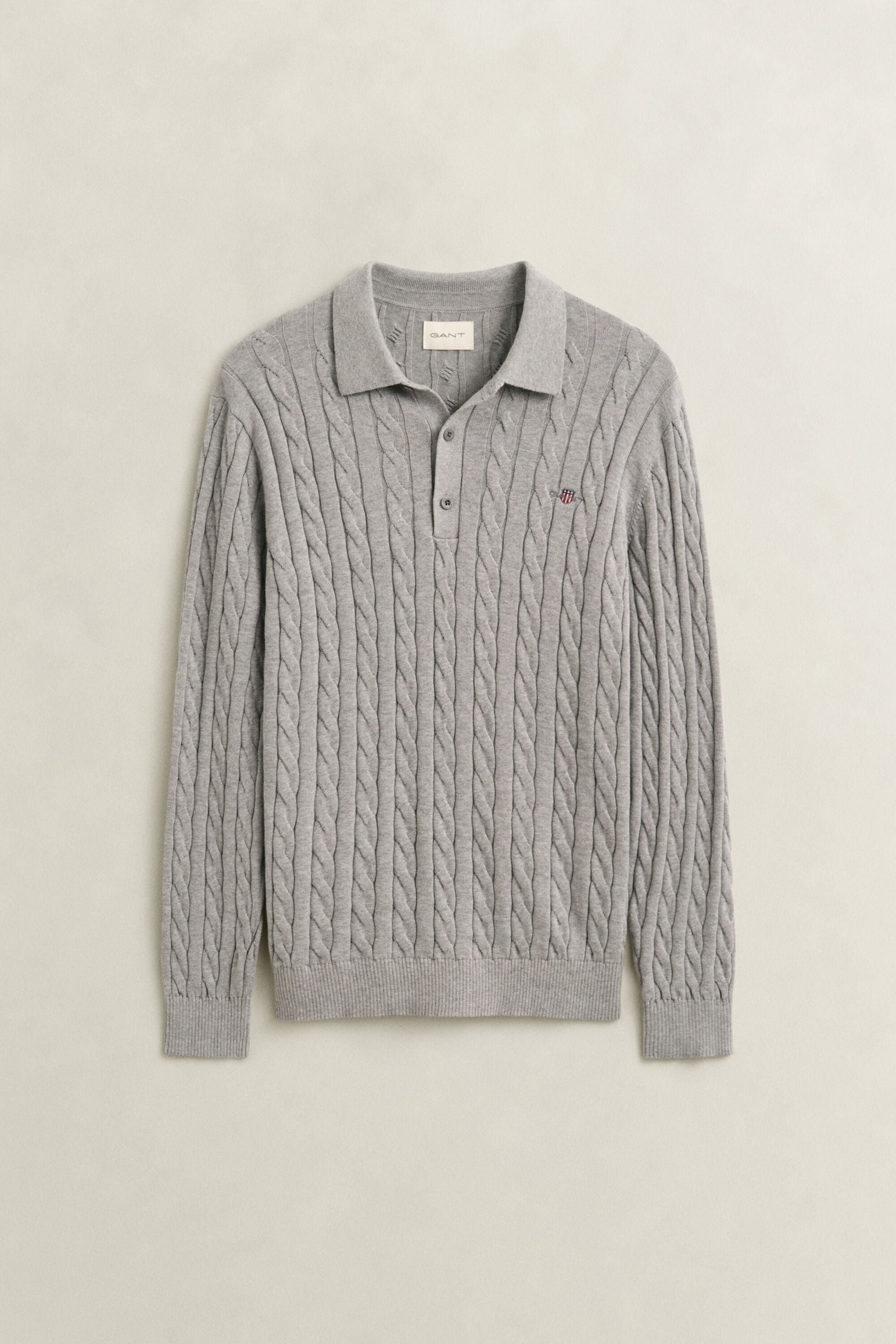 Polosweater i bomuld med kabelstrik