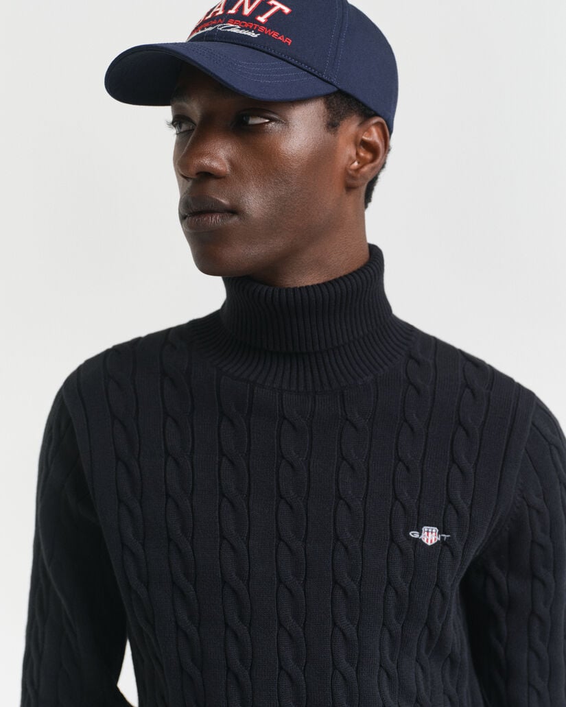 Kabelstrikket sweater af bomuld med rullekrave