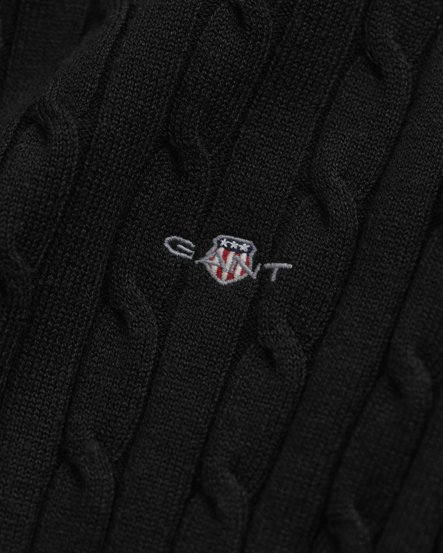 Crewneck sweater af strækbomuld med kabelstrik