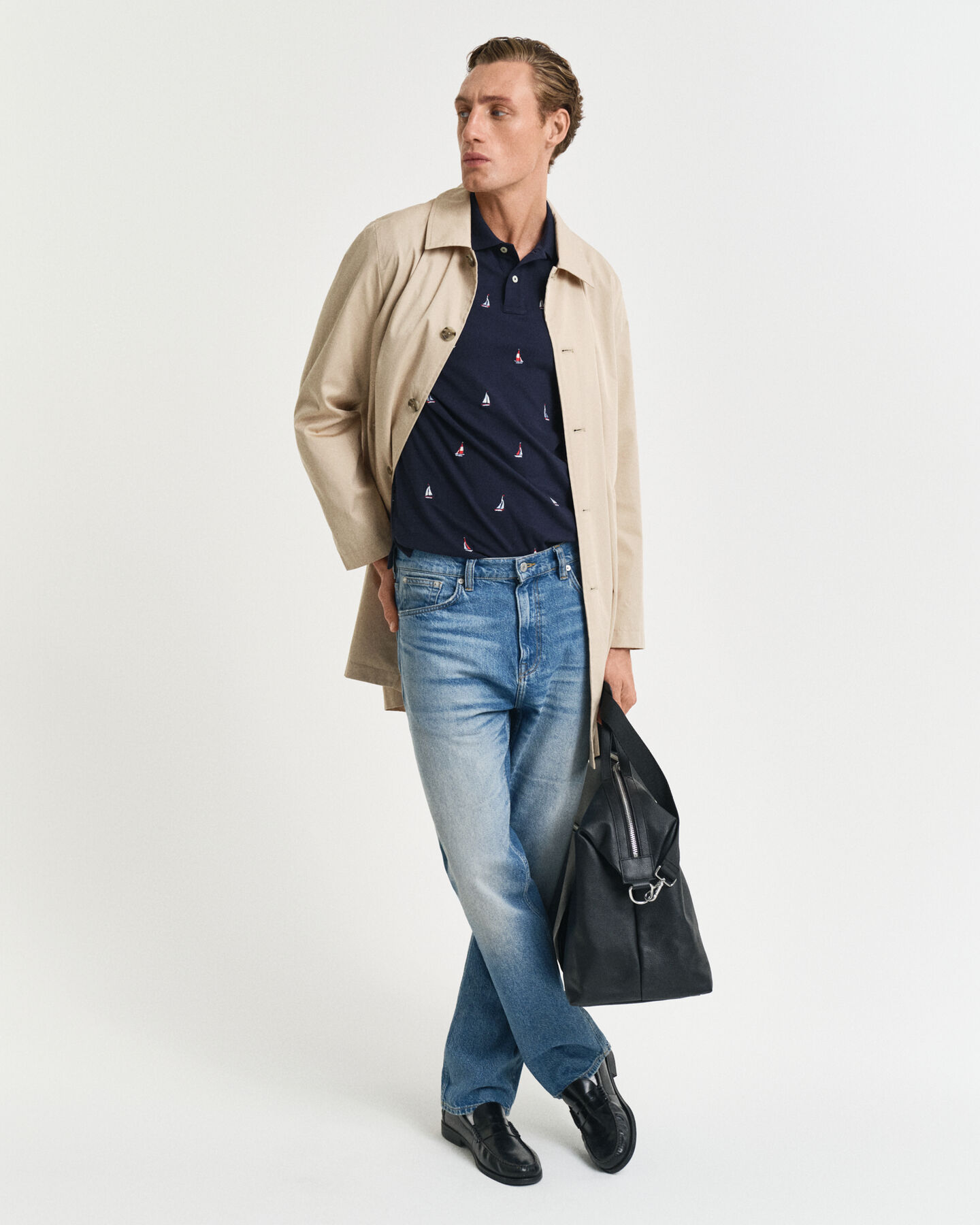 Broderet poloskjorte med båd-grafik