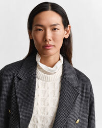 Ternet håndsyet frakke