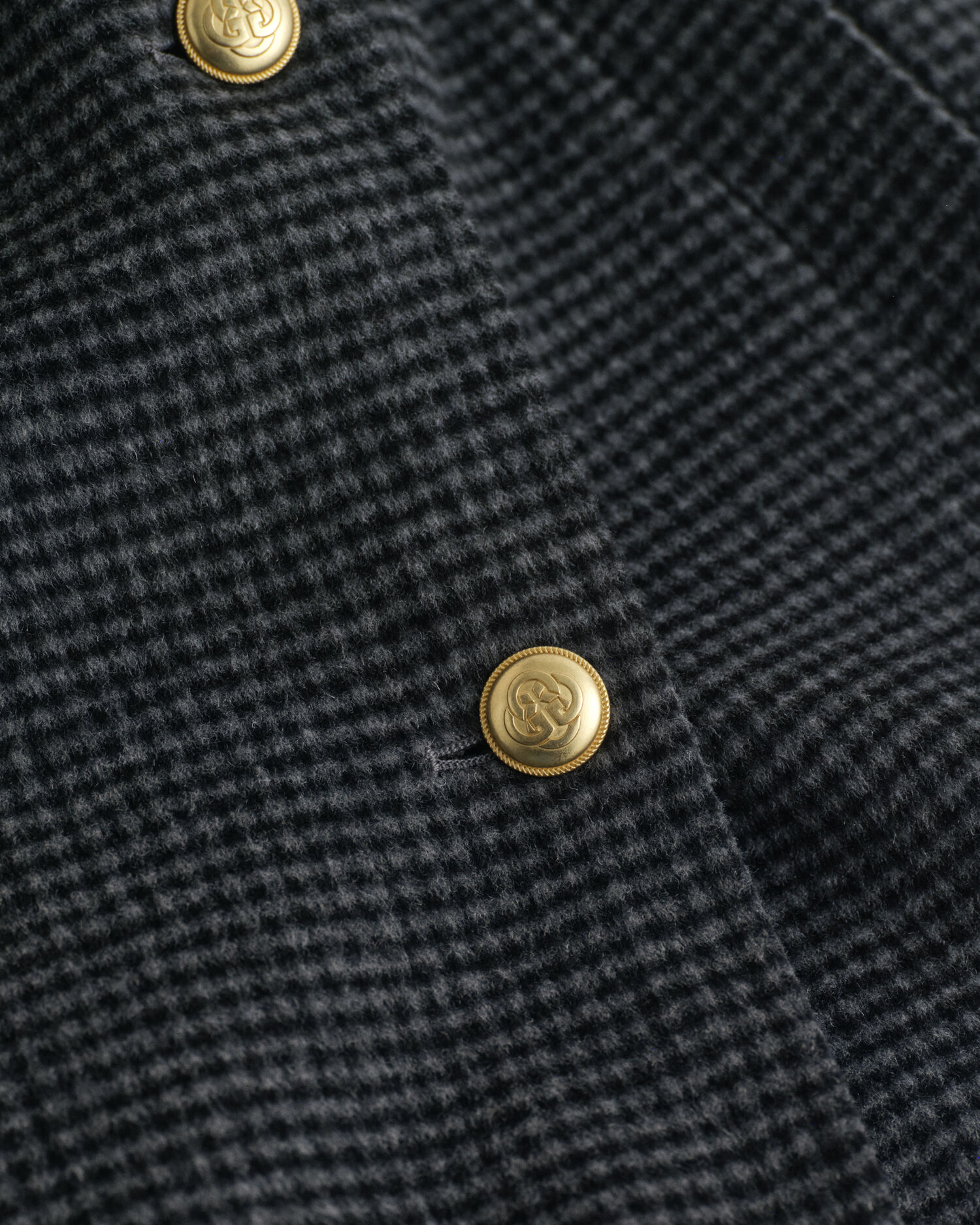 Ternet håndsyet frakke