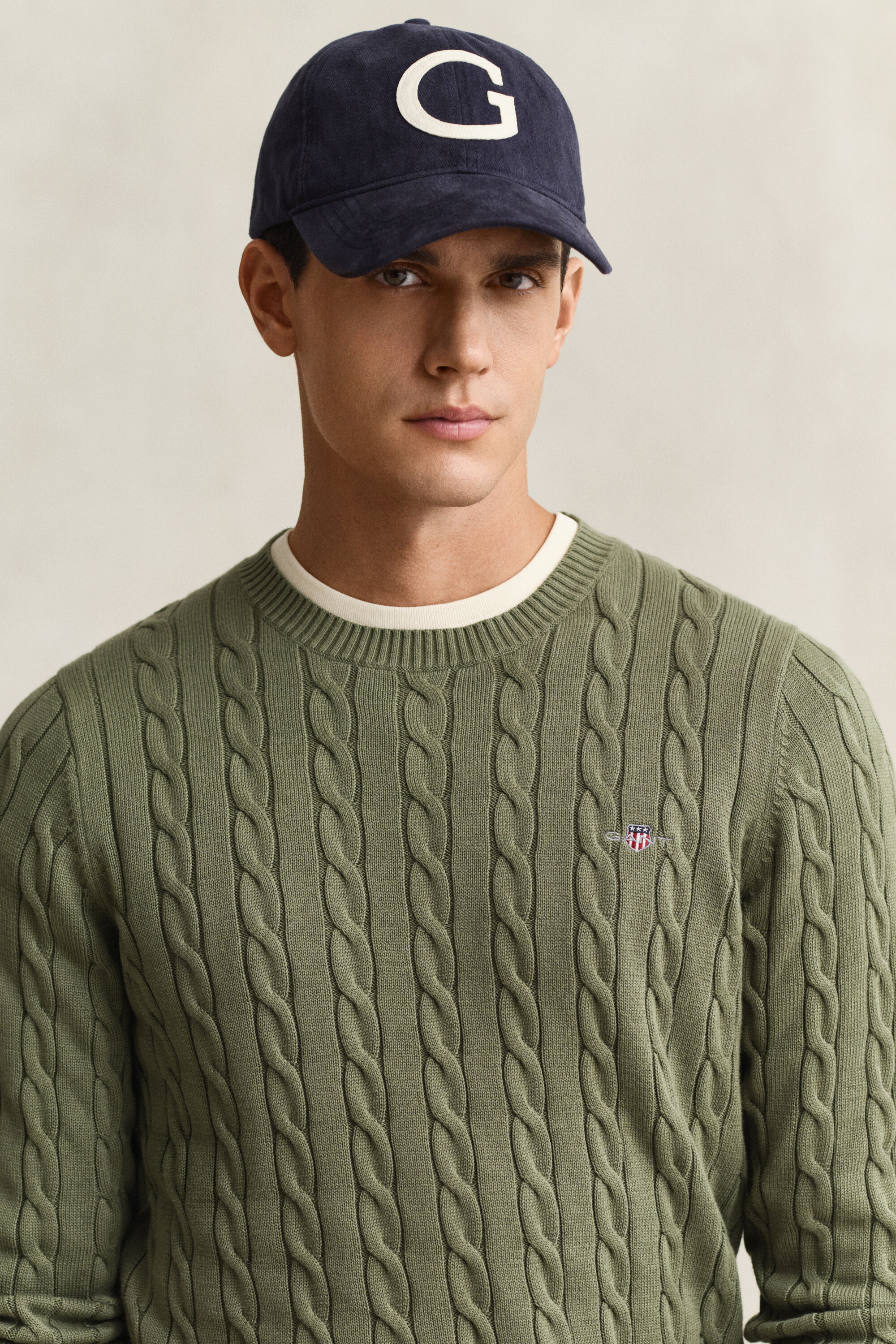 Crewneck sweater af bomuld med kabelstrik