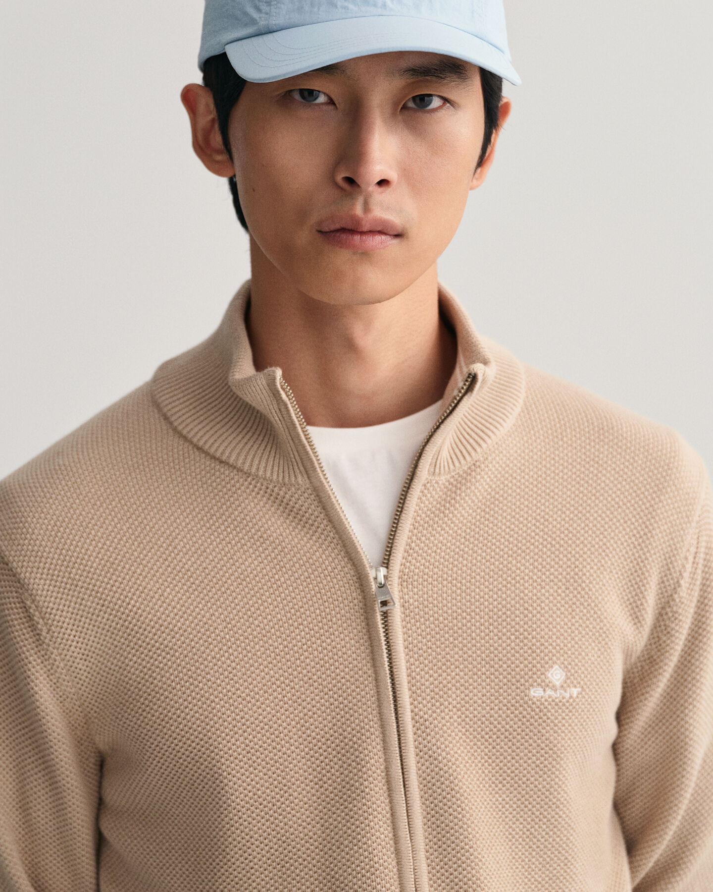 Cardigan af bomuldspiqu&eacute; med lynl&aring;s