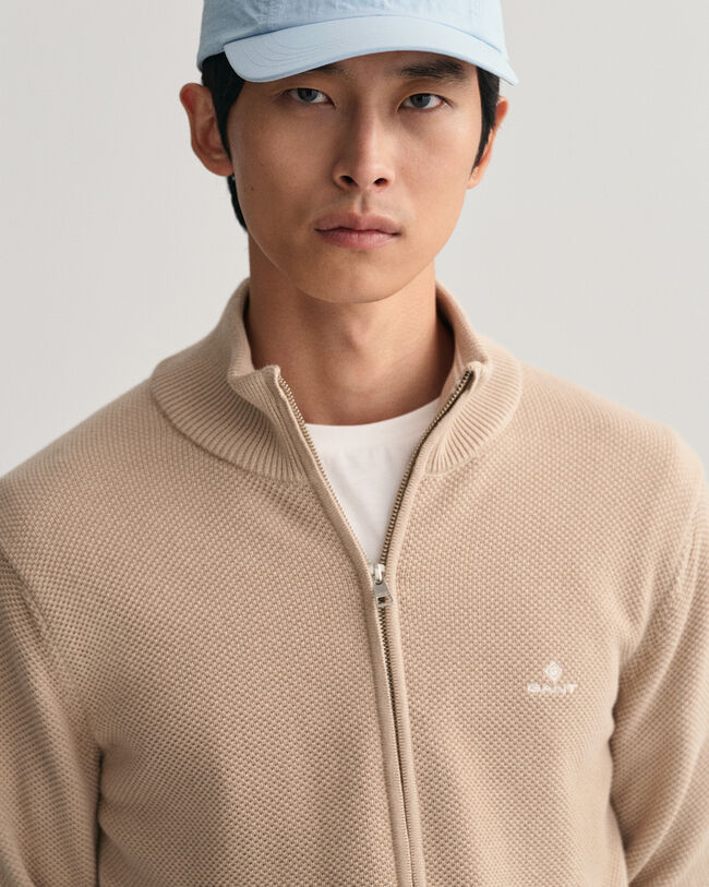 Cardigan af bomuldspiqu&eacute; med lynl&aring;s