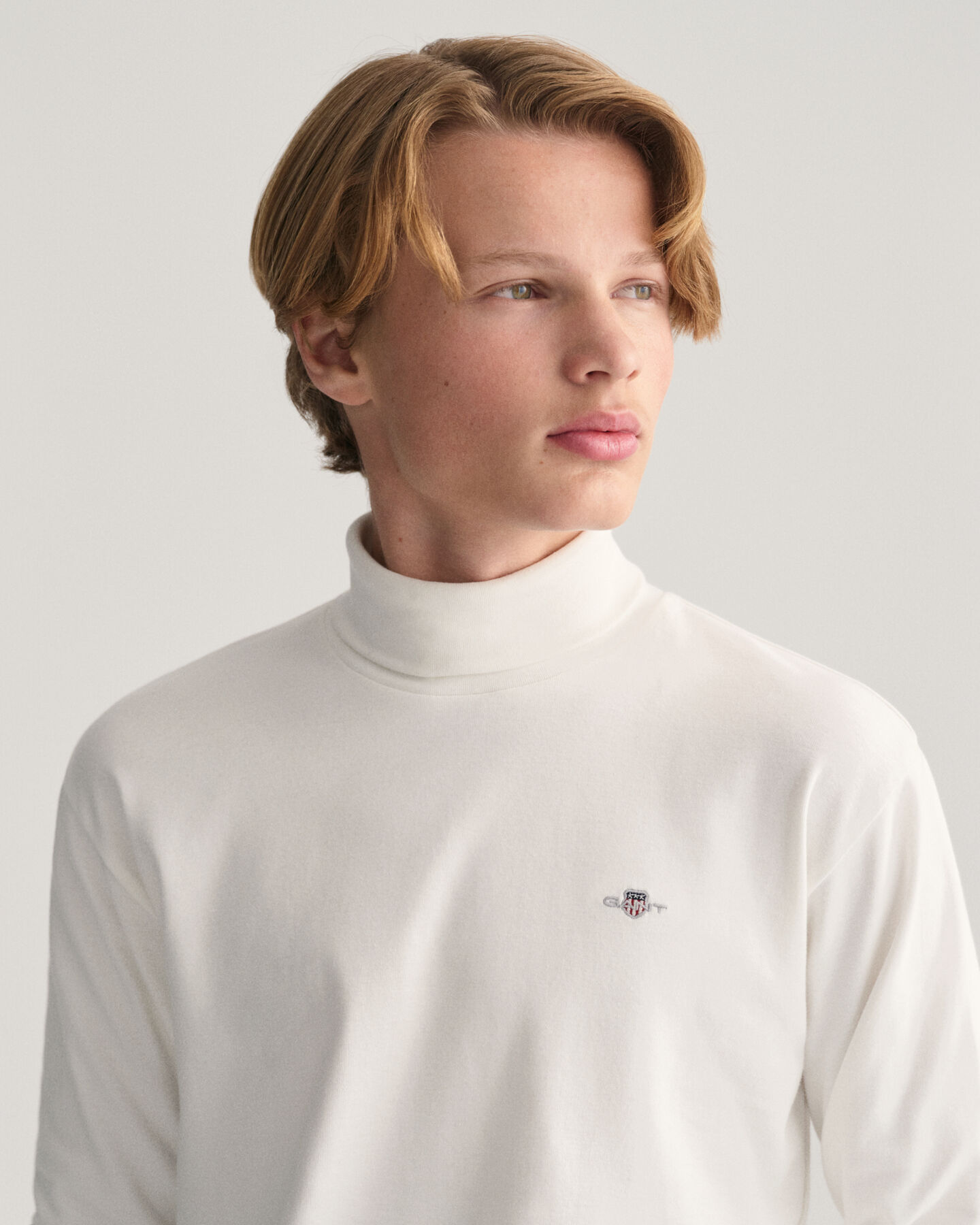 Teens Shield lang&aelig;rmet top med rullekrave