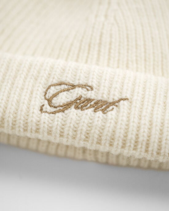 Baby beanie med øreklapper og pompon