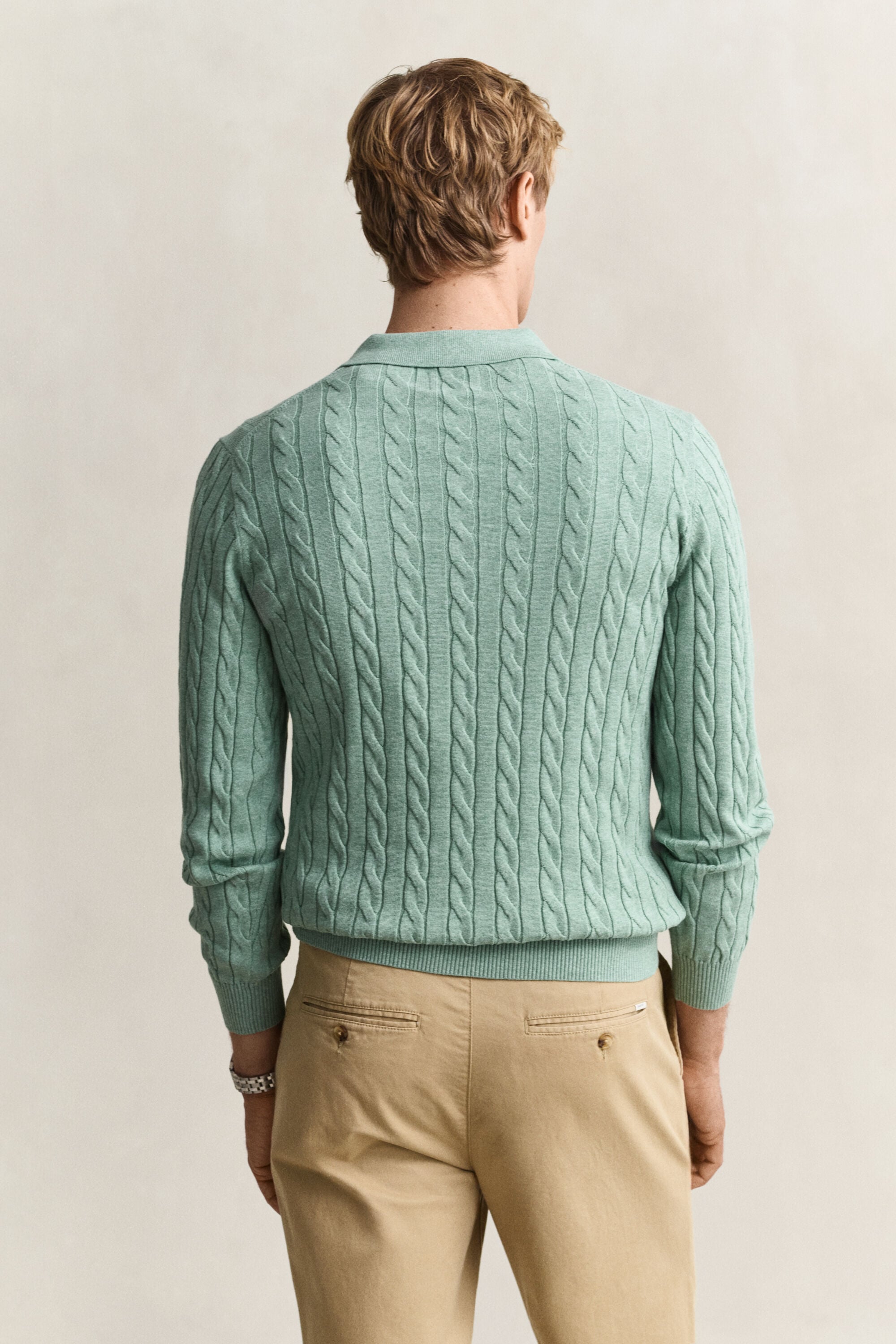 Polosweater i bomuld med kabelstrik