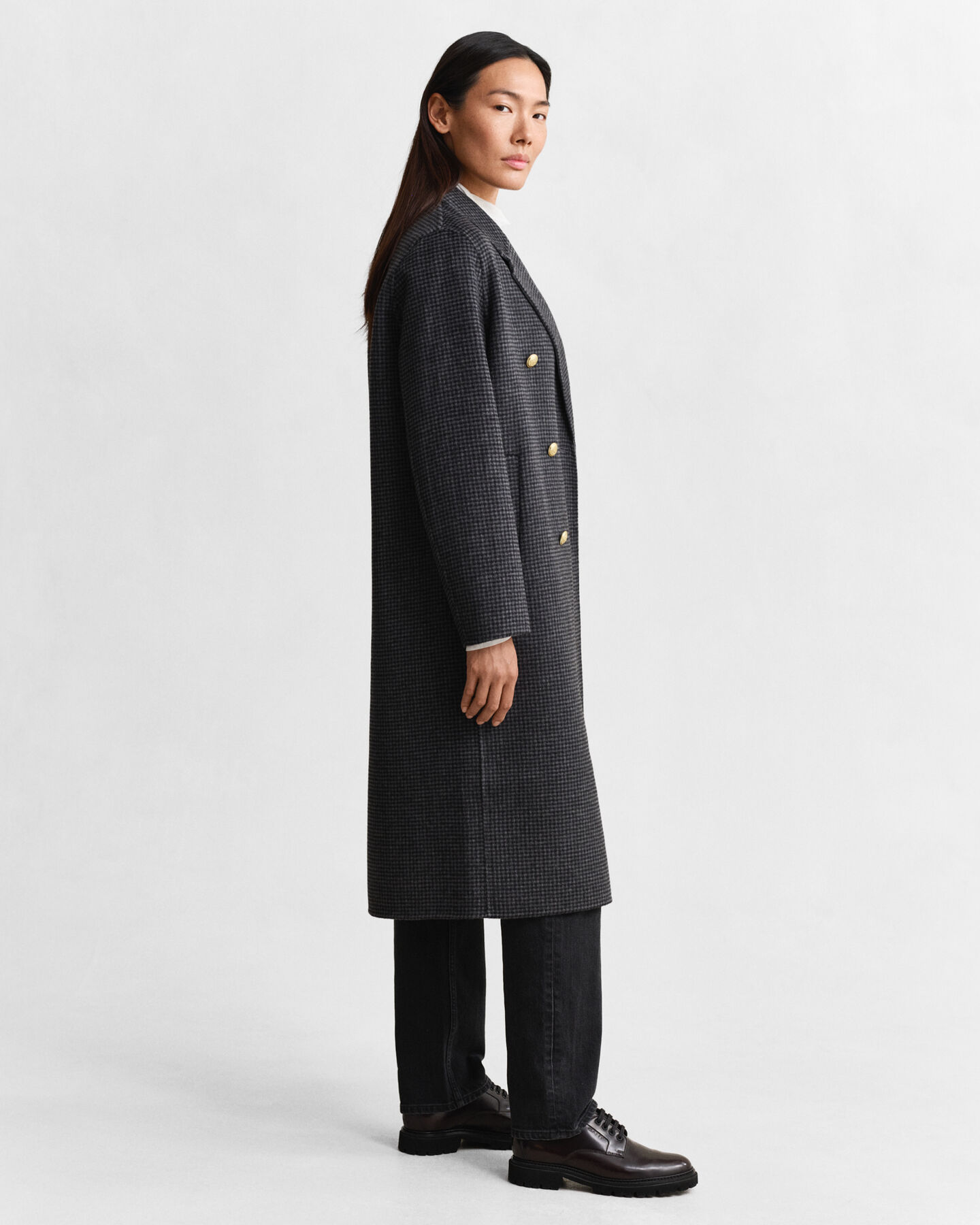 Ternet håndsyet frakke