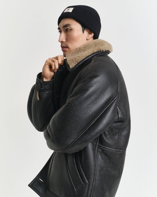 Ribstrikket beanie af bomuldsblanding