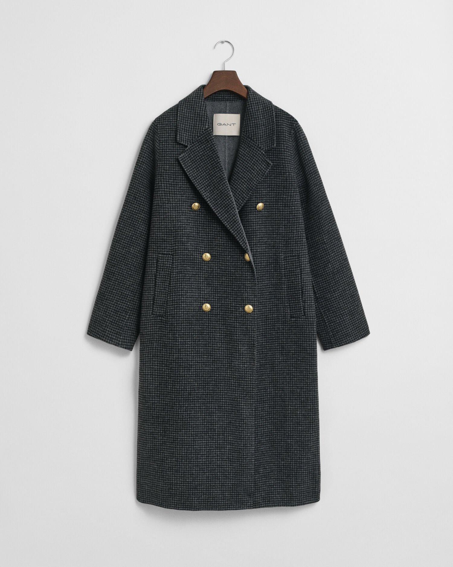 Ternet håndsyet frakke