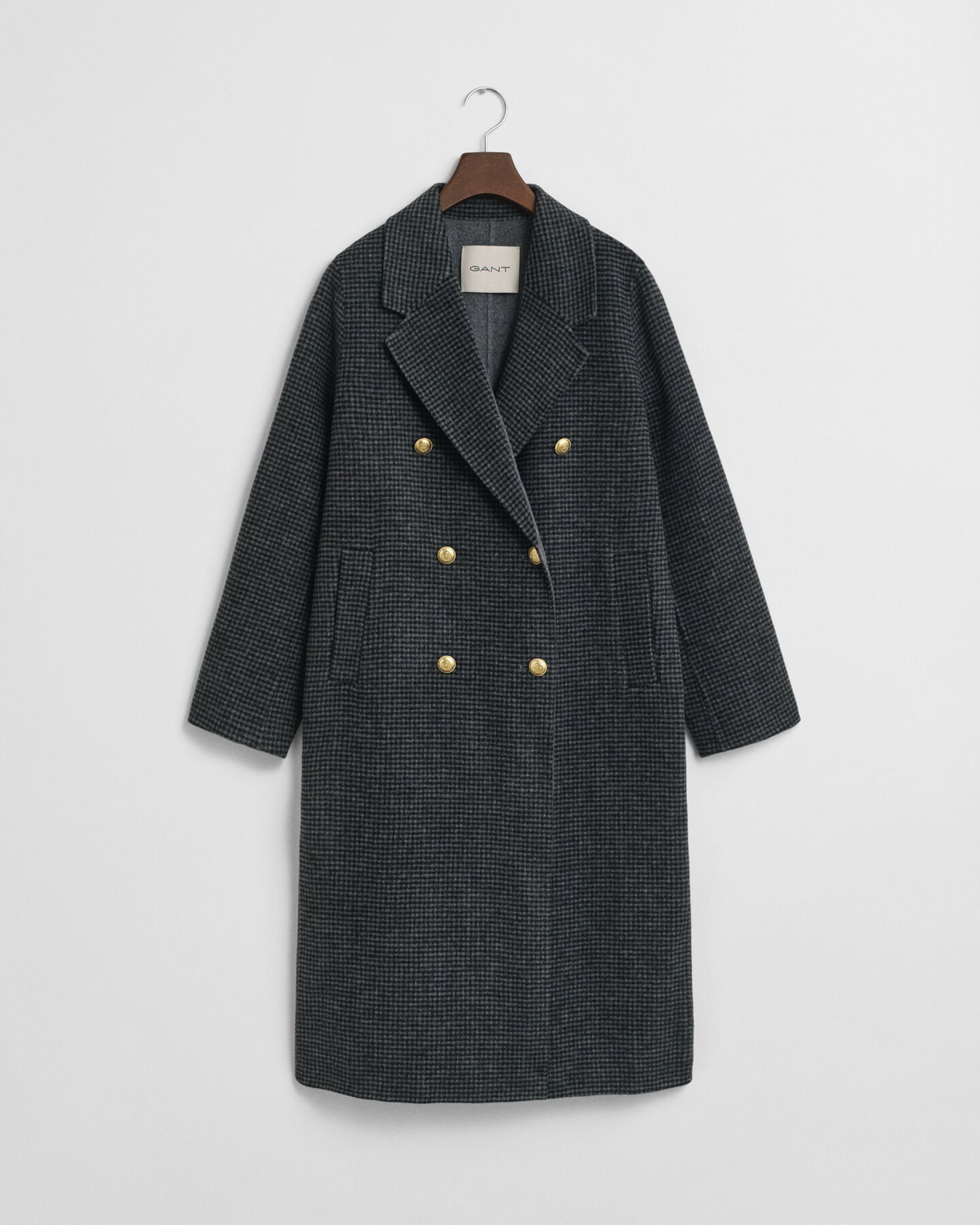 Ternet håndsyet frakke