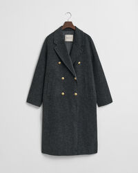 Ternet håndsyet frakke