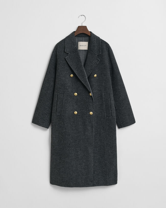 Ternet håndsyet frakke