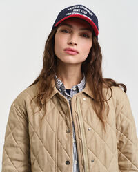 Quiltet frakke med detaljer i jernbanefløjl