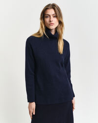 Sweater med rullekrave og sildebensmønstrede detaljer