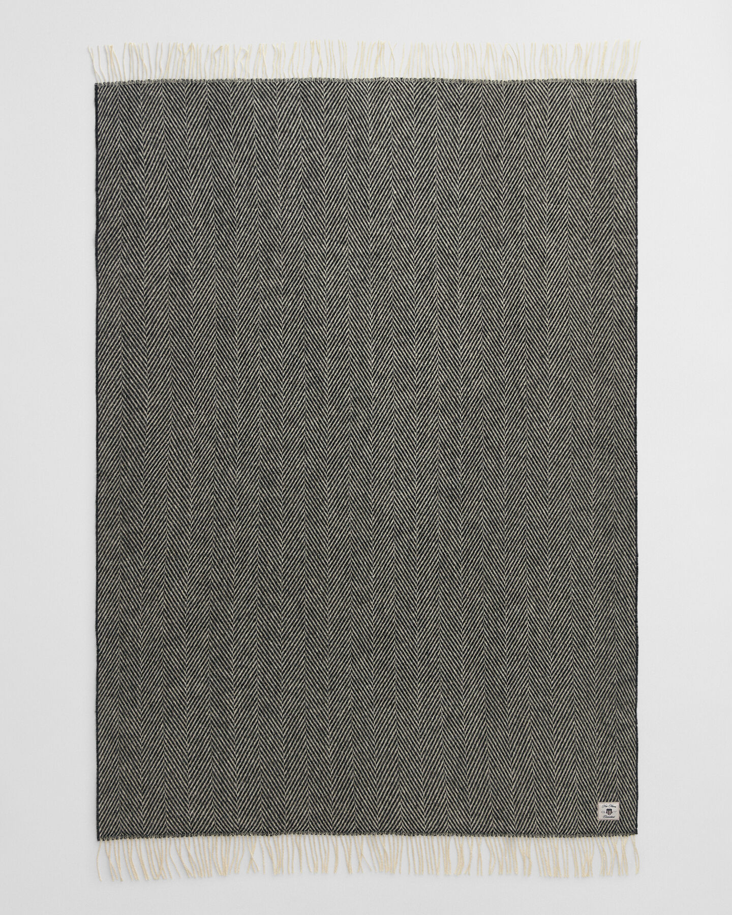 Sildebensmønstret uldtæppe