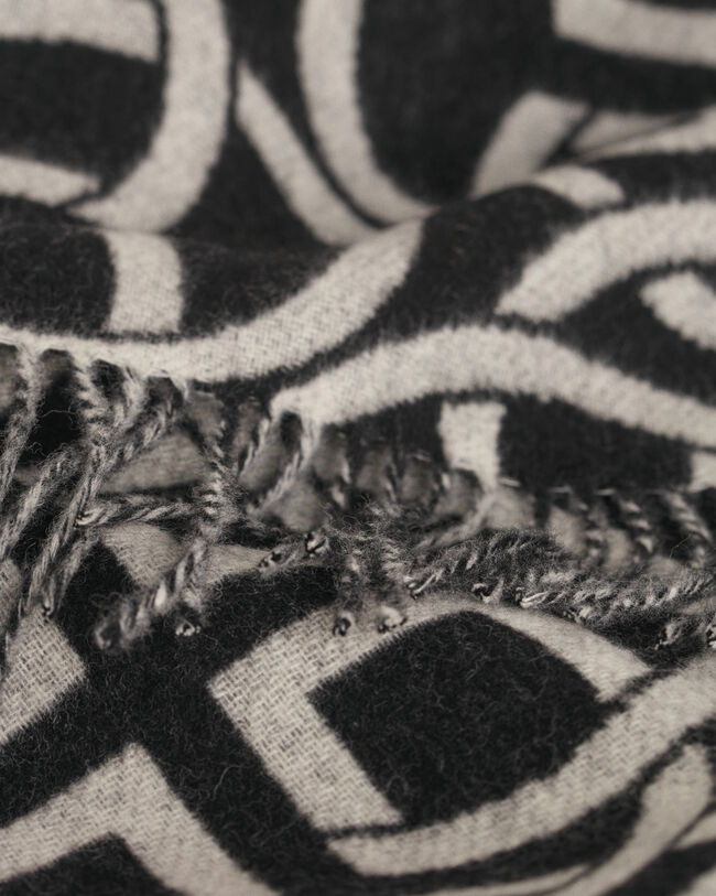 Poncho af uld med G-m&oslash;nster