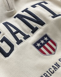 Retro Shield sweater med halv lynlås