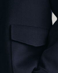 Håndsyet jakke med 4 lommer