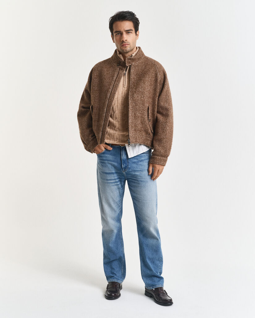 Kabelstrikket sweater af lammeuld med halv lynlås