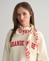 Tørklæde i bomuld og silke med trykt tekst