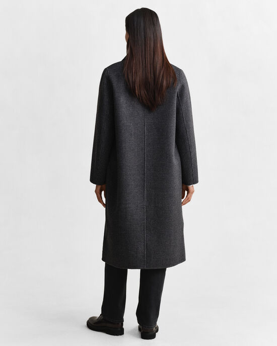 Ternet håndsyet frakke