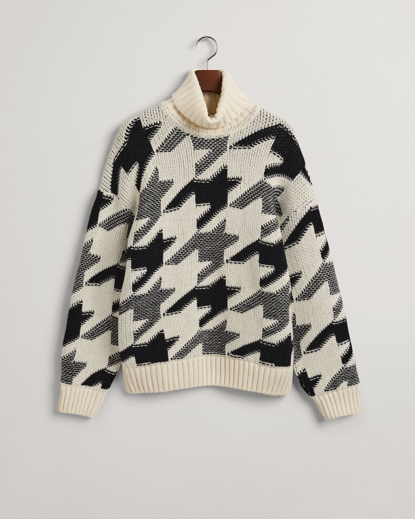 Houndstooth sweater med rullekrave